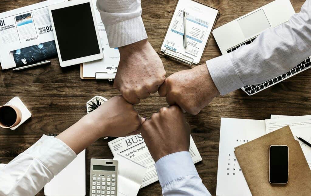 image of all team member hands in a circle
