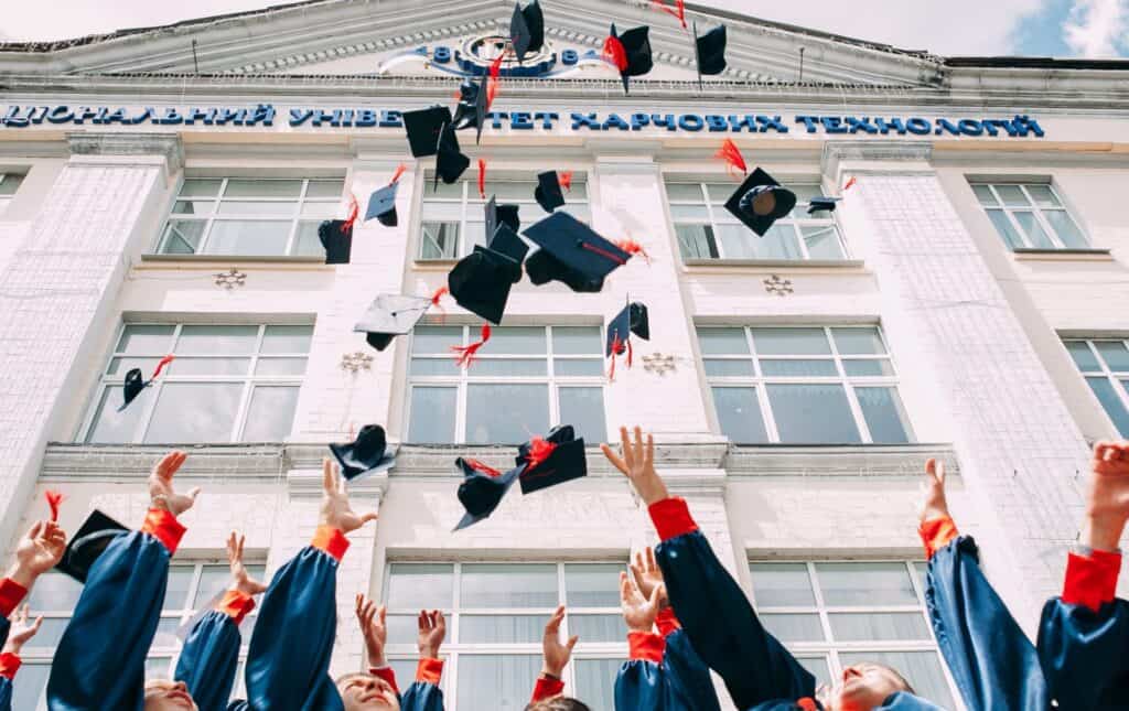 image of graduation hats being tossed