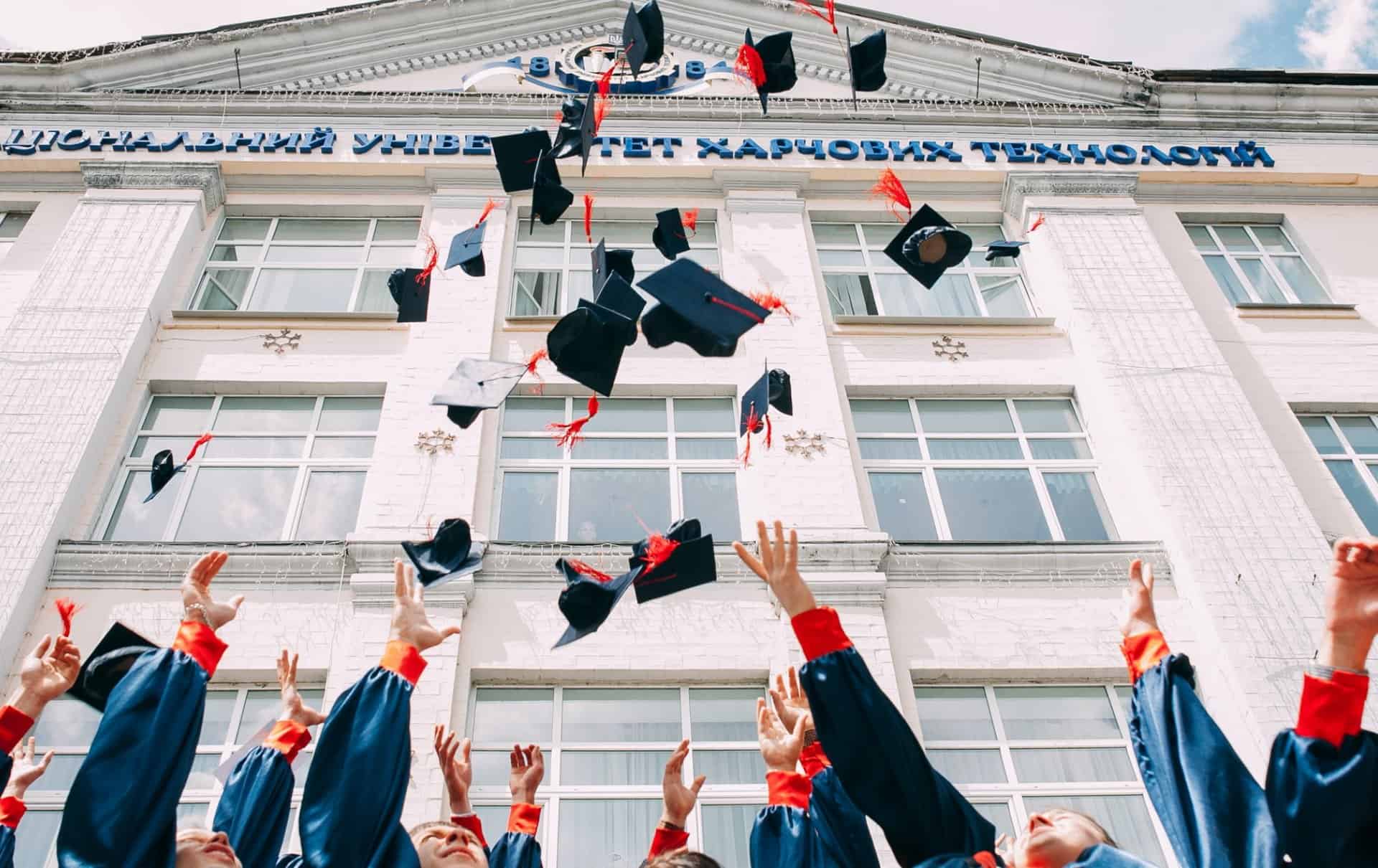 image of graduation hats being tossed