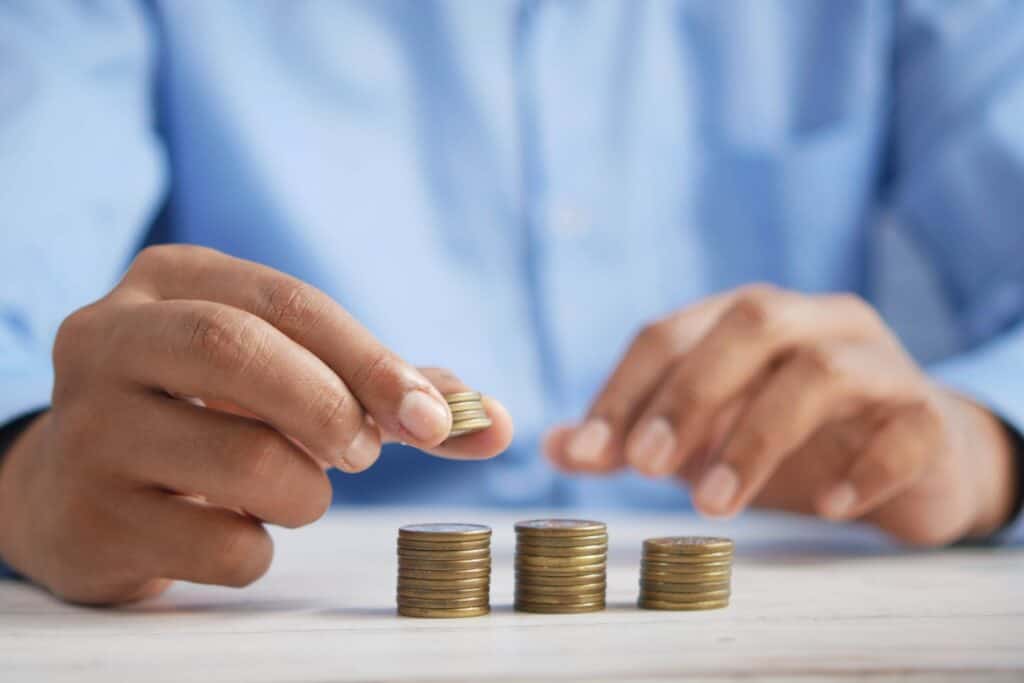 image of a man stacking coins