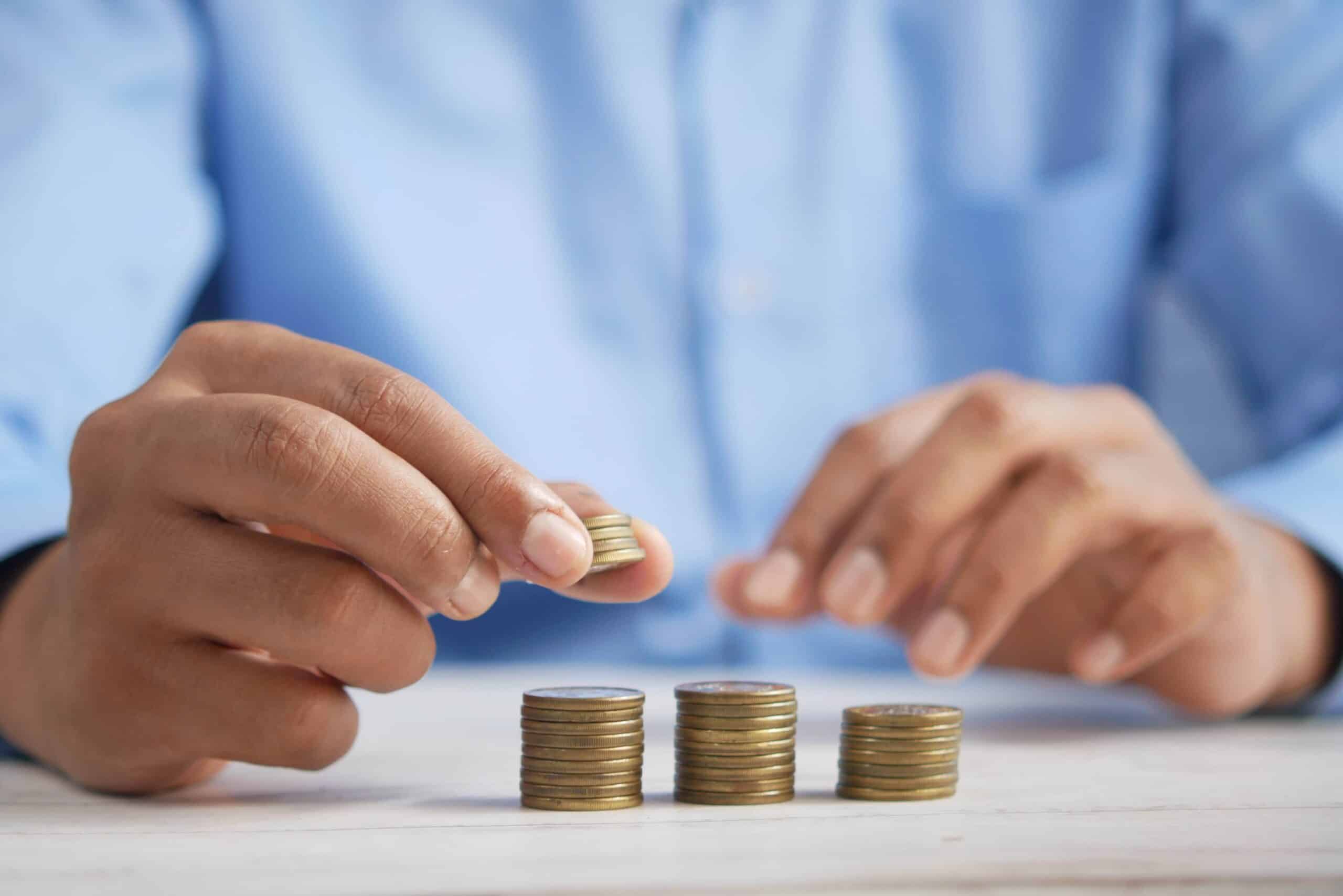 image of a man stacking coins