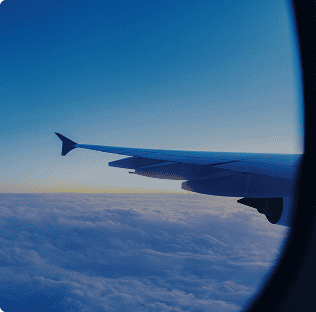 image of the view of a planes wing from the inside of the plane
